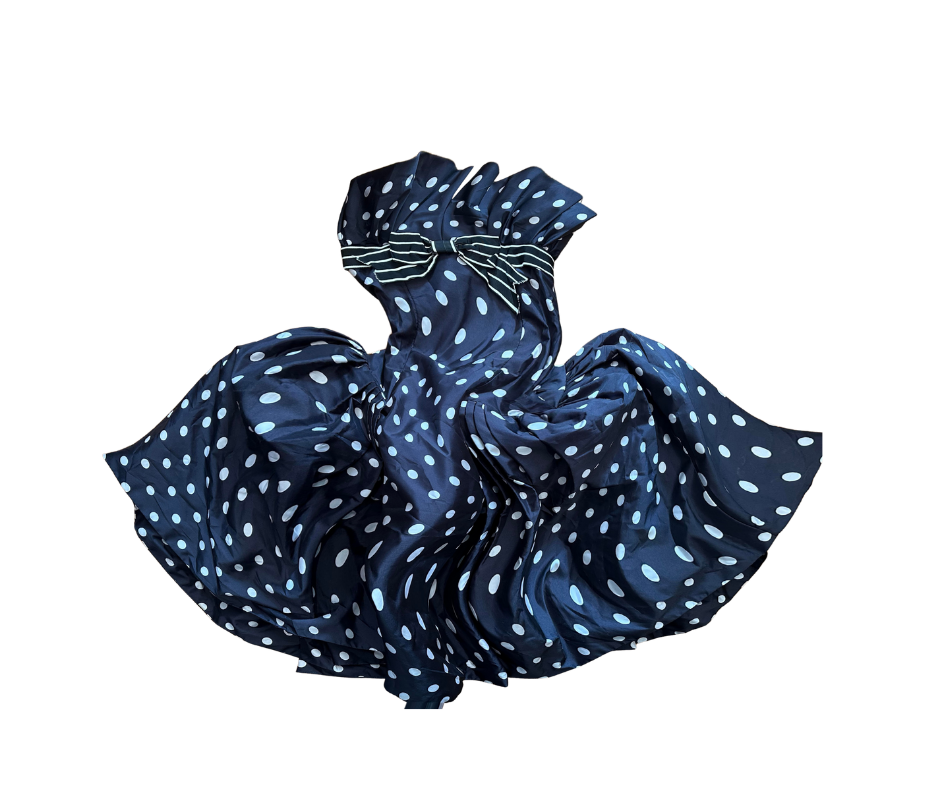 A black-and-white polka dot dress on a white background, distorted.